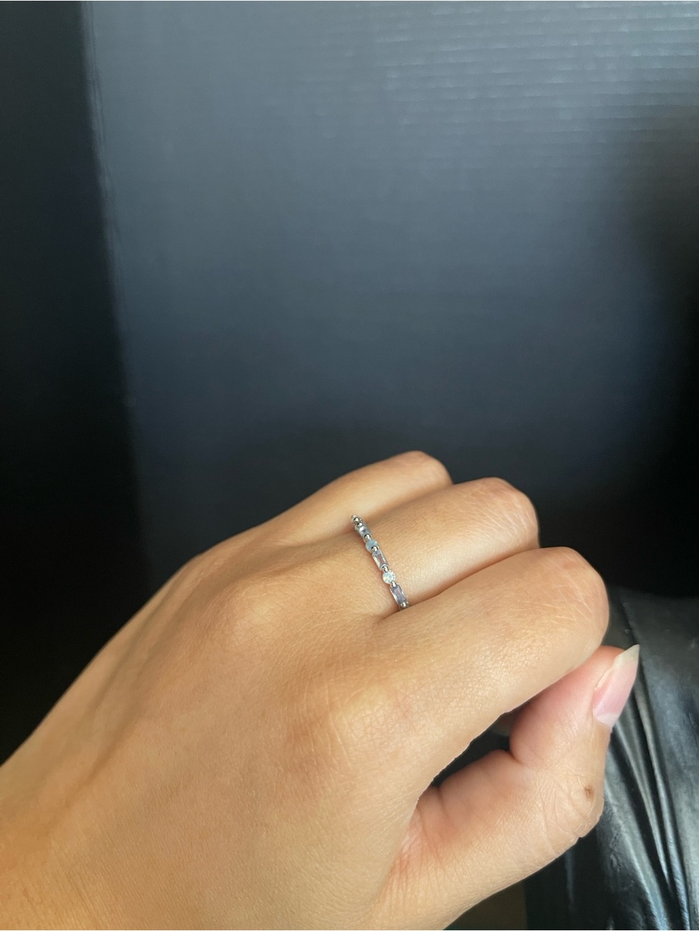 Blue emerald cut and circle cut silver tone band ring